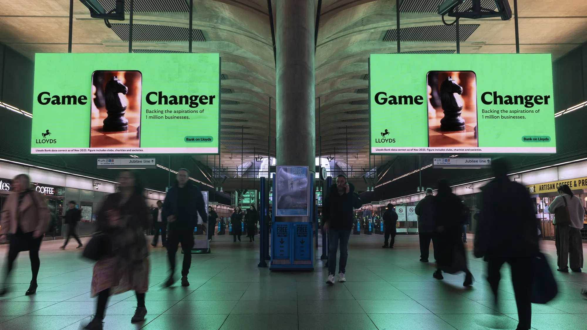 Game Changer on twin screens at Canary Wharf station